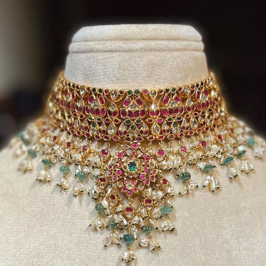A stunning heavy choker neckpiece featuring mint-colored drops, embellished with pink stones, exuding elegance